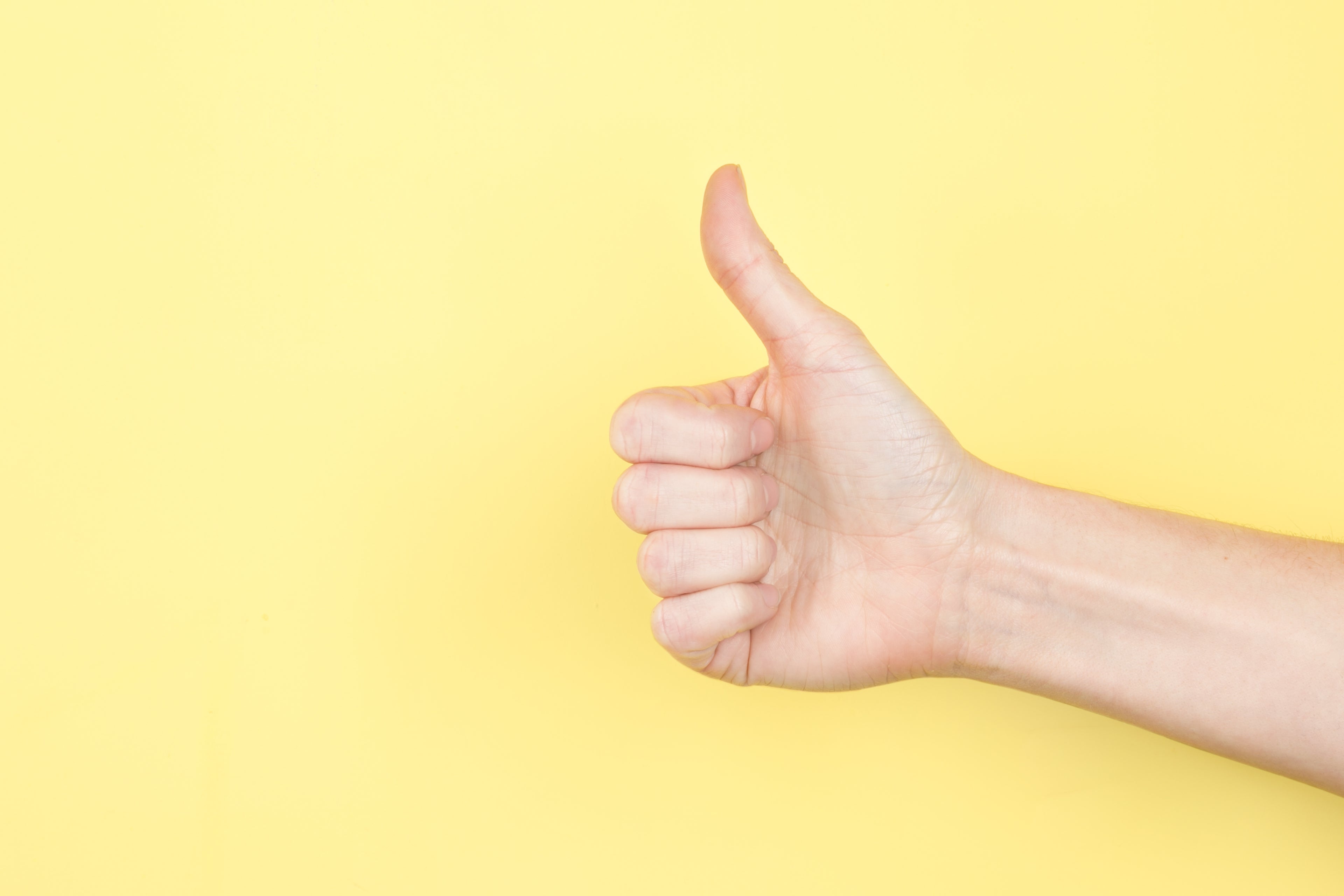 The Stamina for Men footer image showing a thumbs up on a yellow background