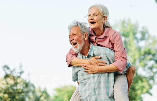 A Stamina for Men Happy active senior couple having fun outdoors. Portrait of an elderly couple together