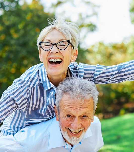 Happy Stamina for Men active senior couple having fun outdoors. Portrait of an elderly couple together