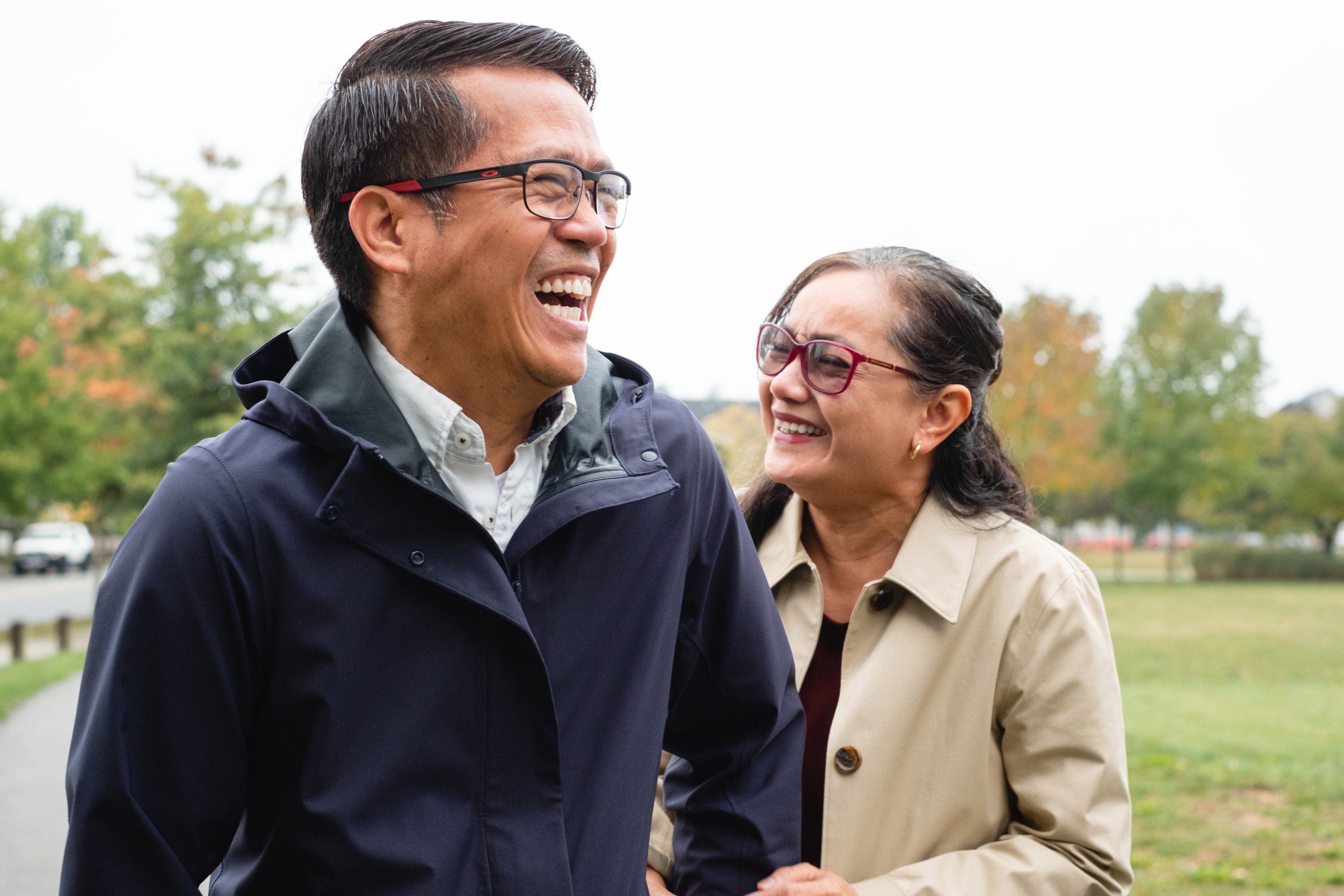 Happy Asian couple embracing each other after experiencing the benefits of Stamina.